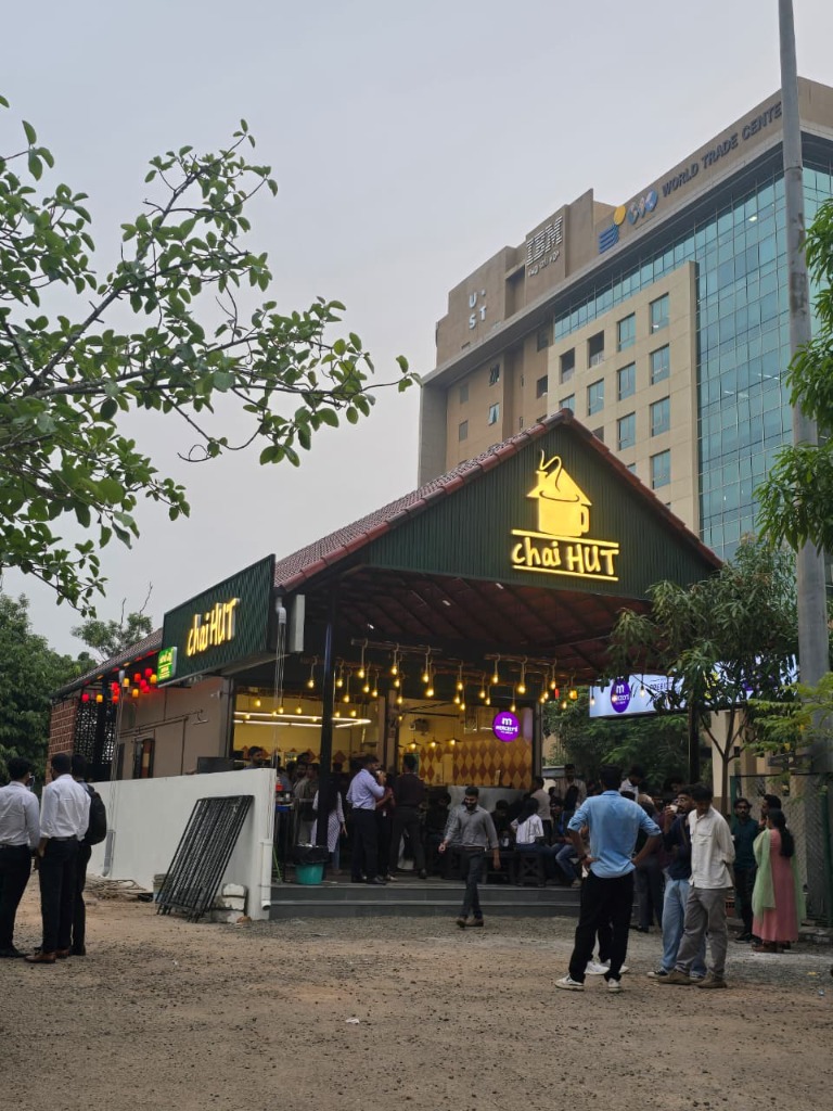 Chai Hut store front at Infopark Kochi with crowd of customers gathered outside